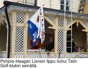 Pohjois-Haagan Lionsin lippu liuhui Talin Golf-klubin seinll.